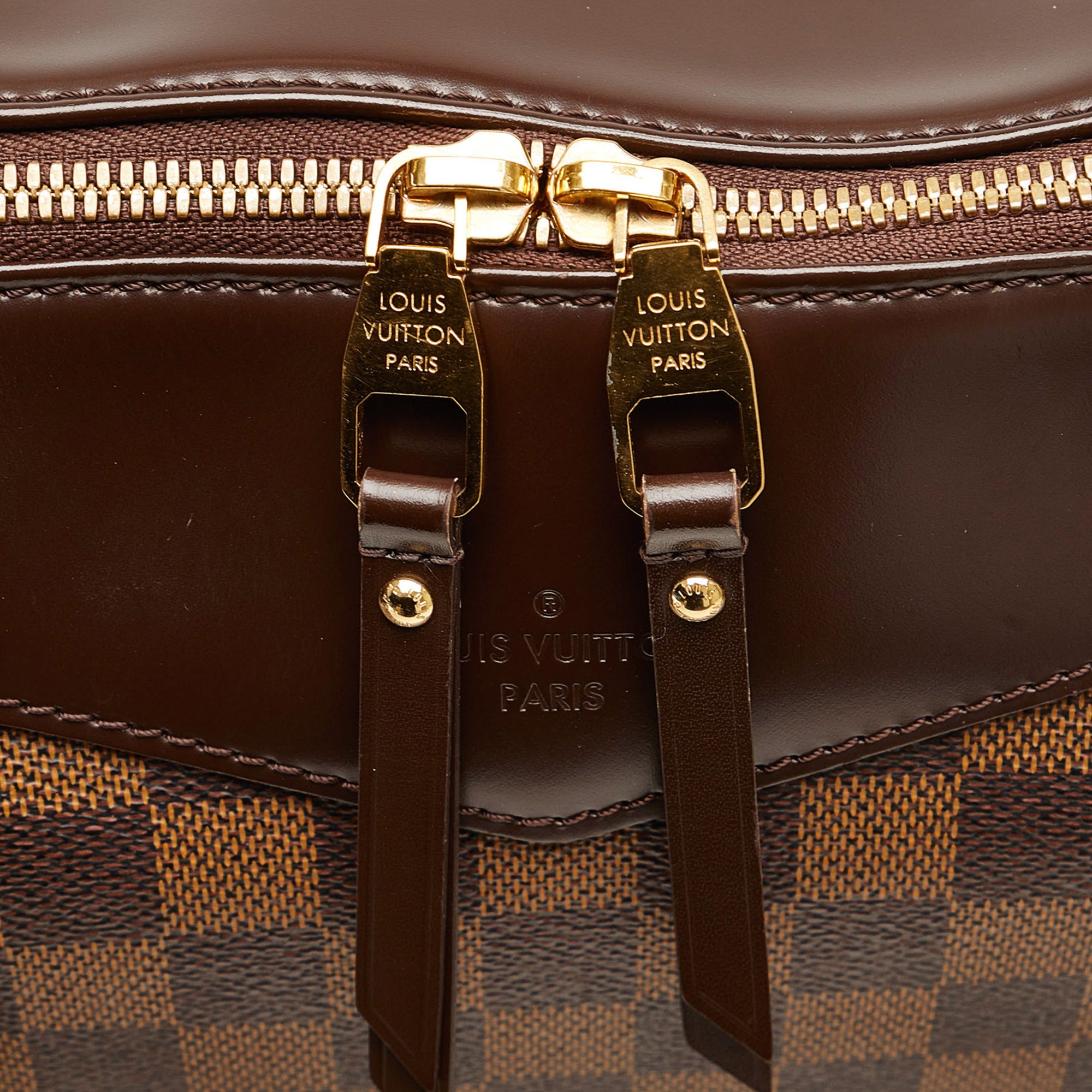 A Damier Eole 50 suitcase, Louis Vuitton. Features Damier leather